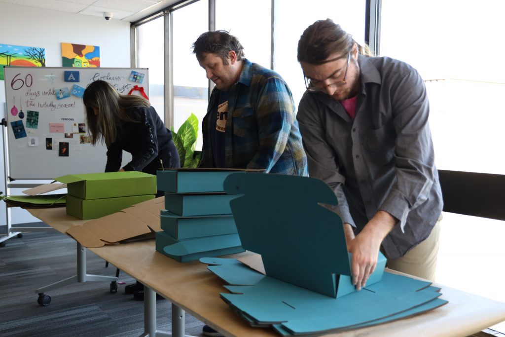 Group of Goodness Gift associates work to fulfill order.