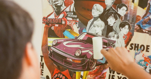 Artist rolling on collage images